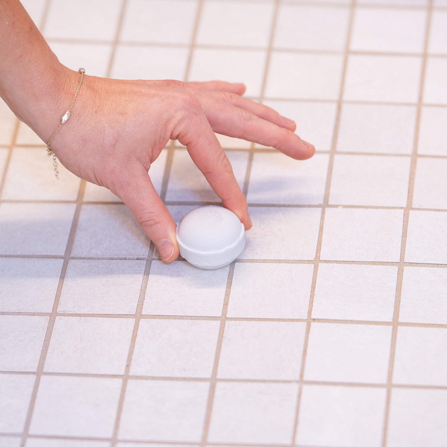 placing shower steamer on shower floor