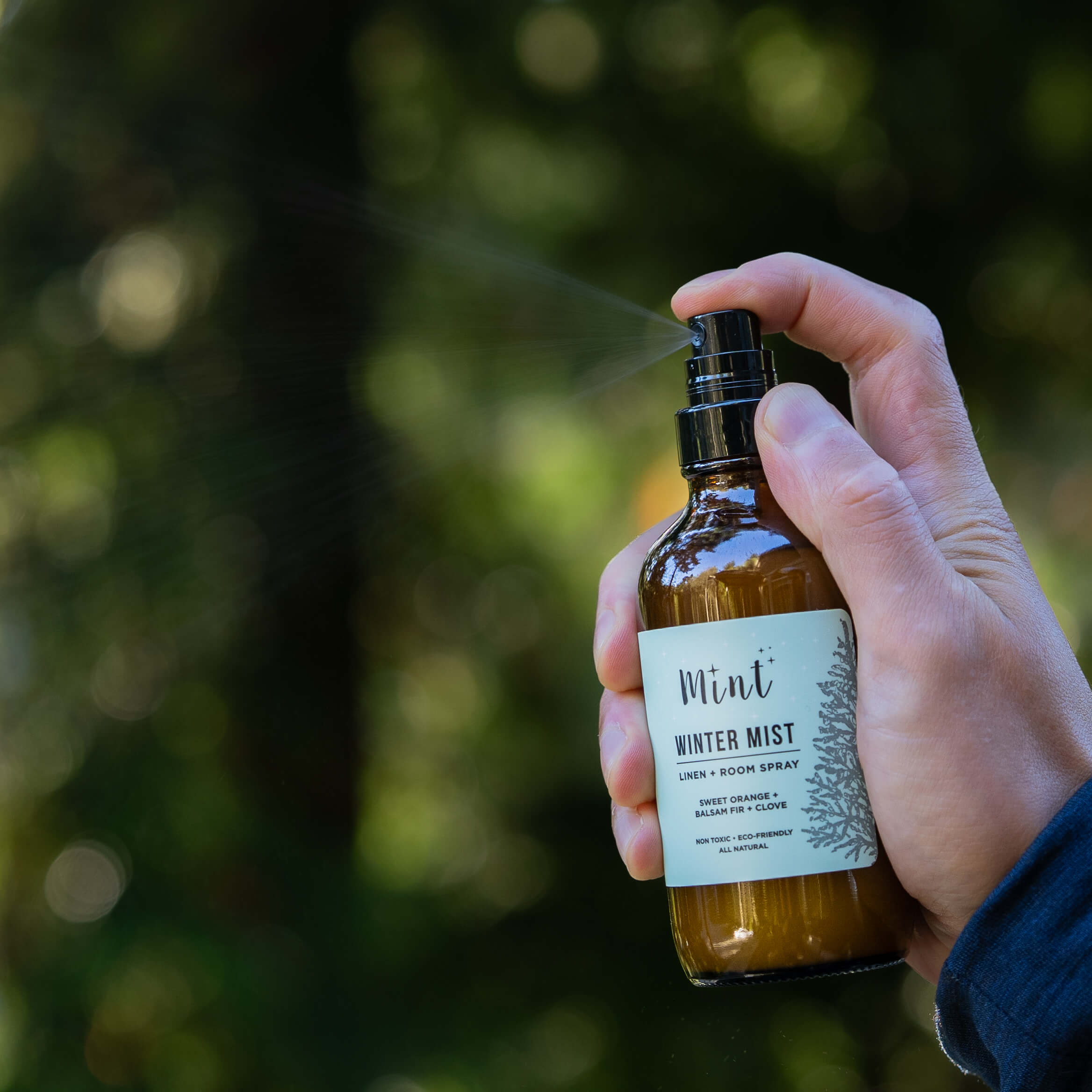 Hand holding a bottle of &