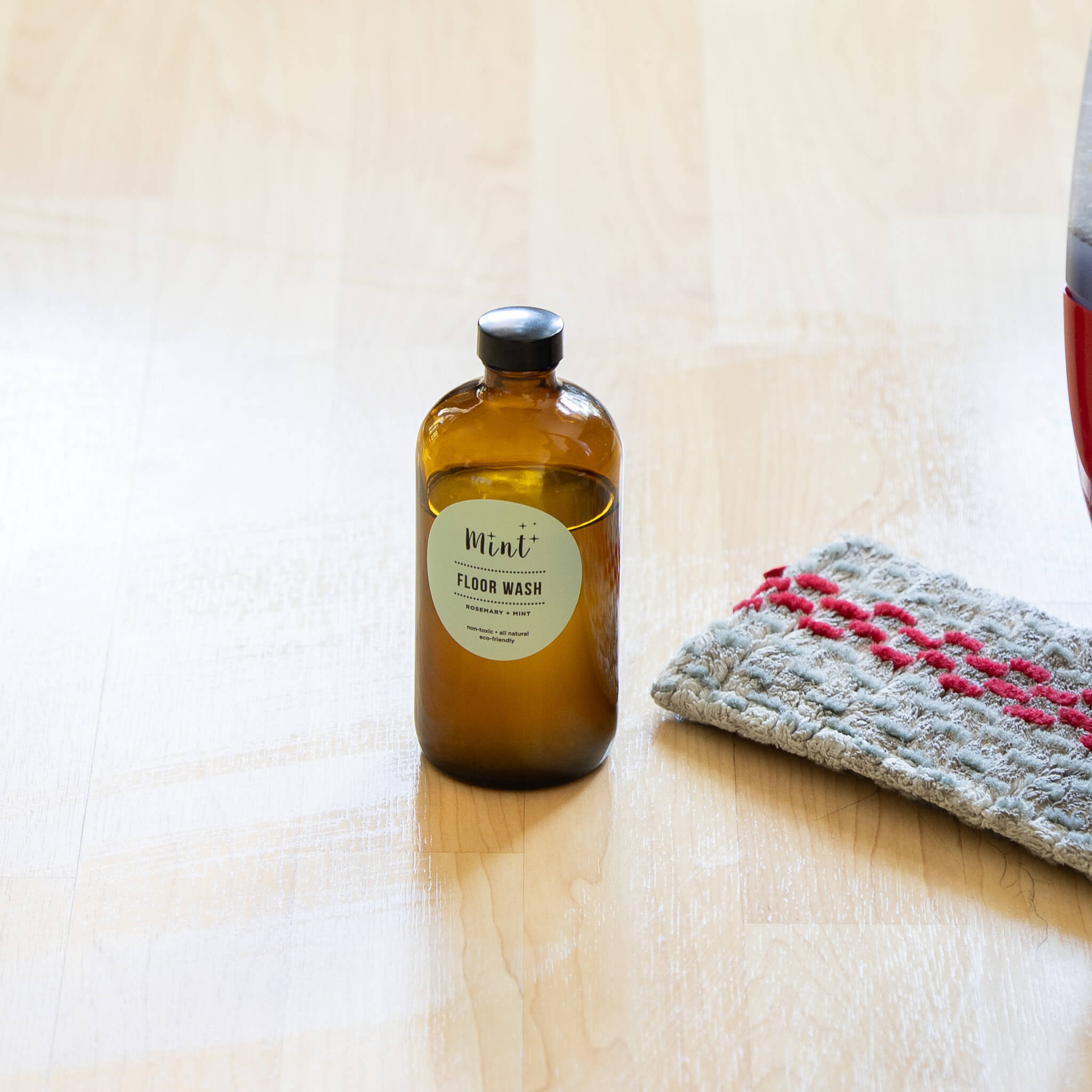 mint floor wash on amber glass bottle