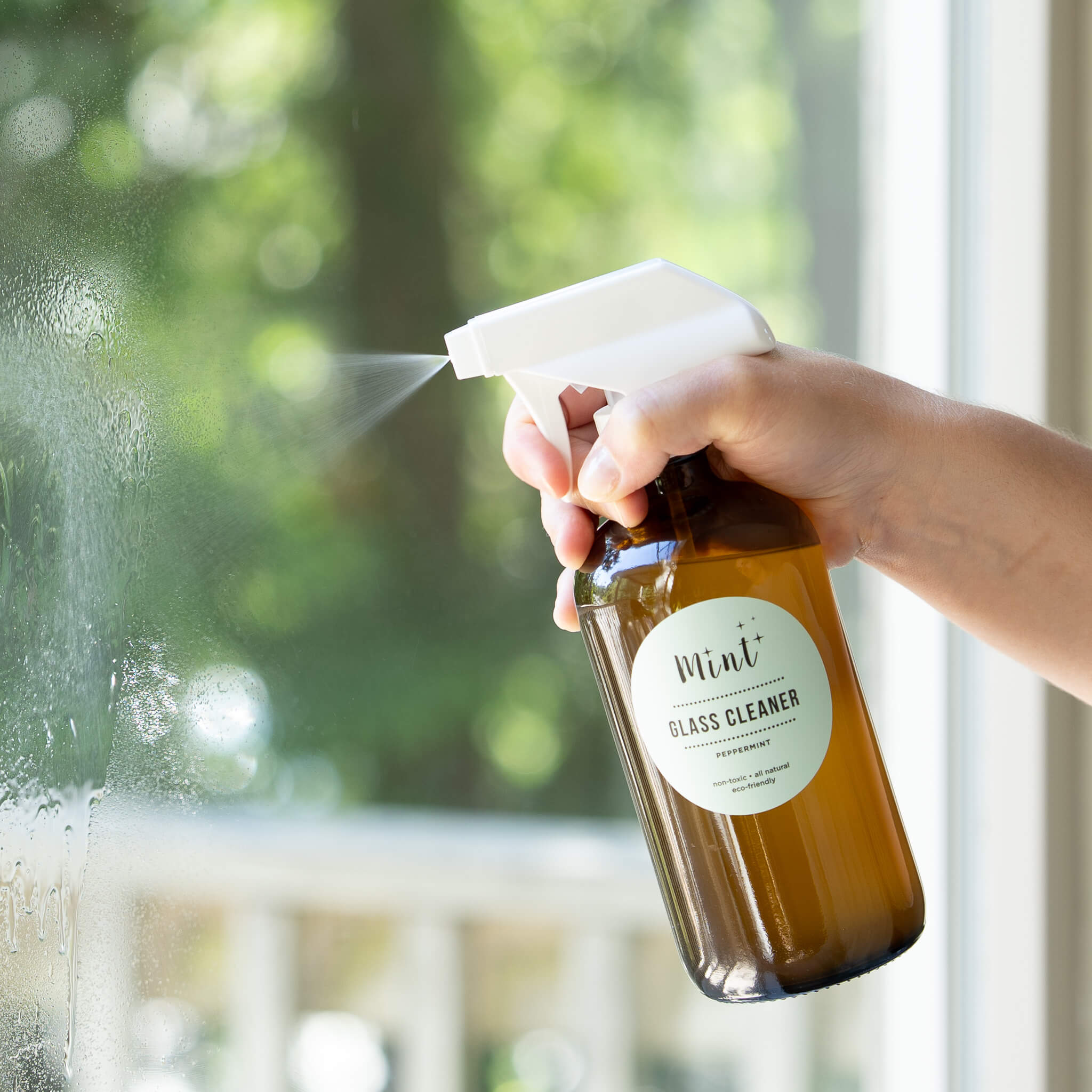 mint glass cleaner on amber glass bottle