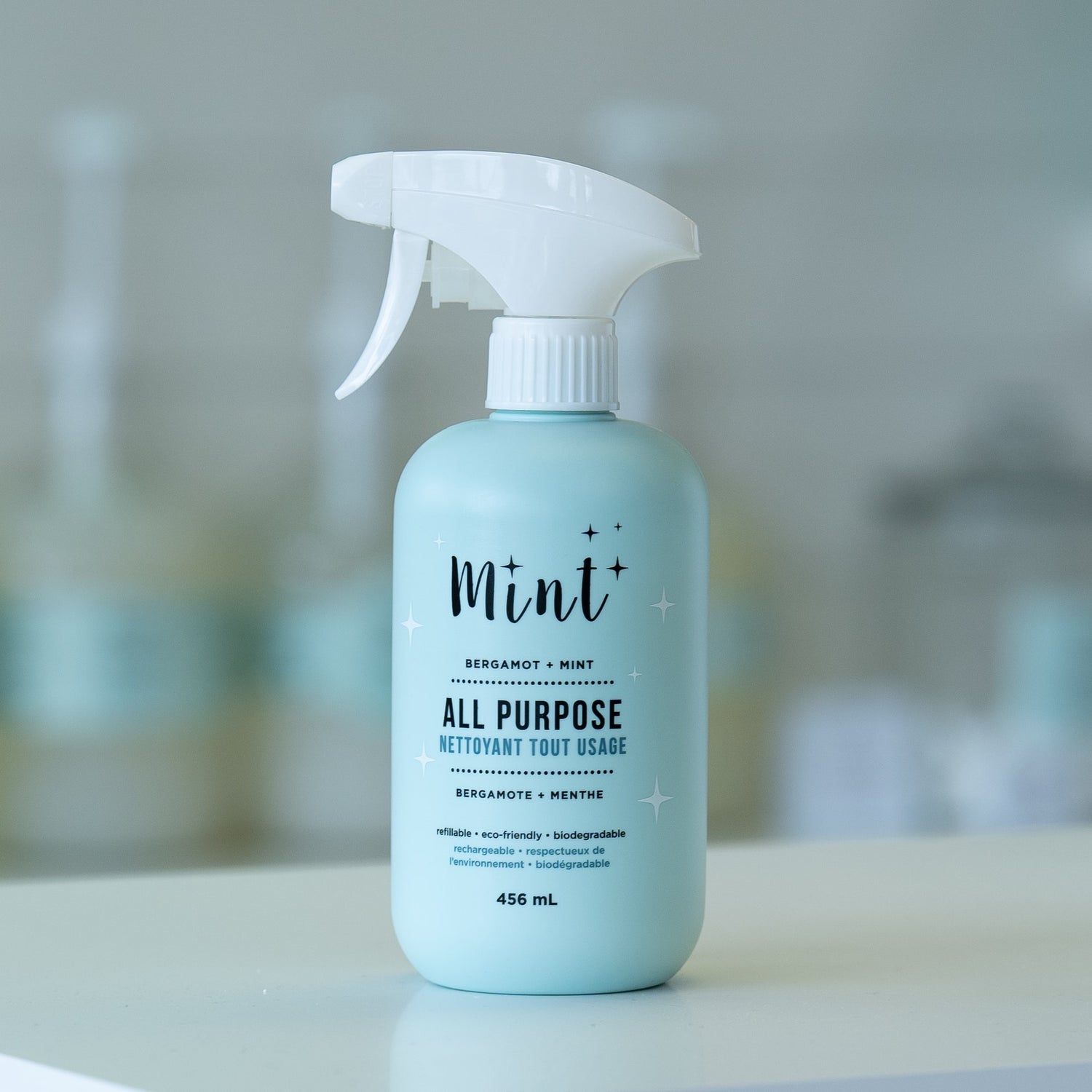 A Mint All Purpose Cleaner bottle on display, emphasizing its sleek design, eco-conscious features, and all-natural formula suitable for multipurpose cleaning.