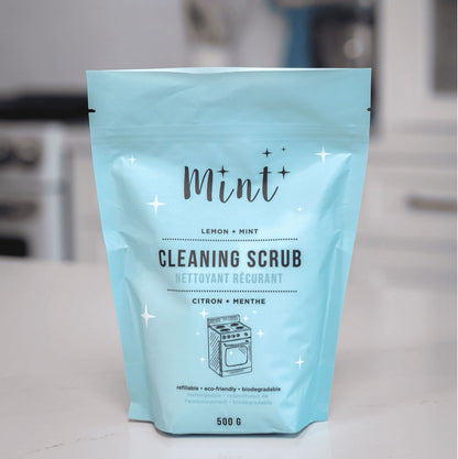 Mint Cleaning Scrub refill pouch displayed on a kitchen counter, showcasing a lemon and mint-scented, refillable and biodegradable product, 500g size.