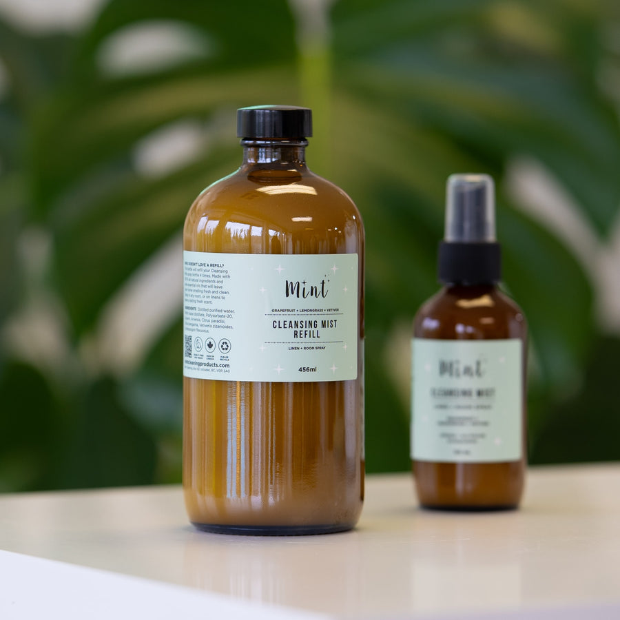 Mint Cleansing Mist Refill in a 456ml amber glass bottle, shown alongside the smaller spray bottle, ideal for refilling and refreshing your linen and room spray.