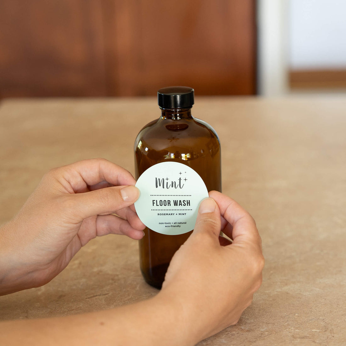 mint floor wash label on amber glass bottle
