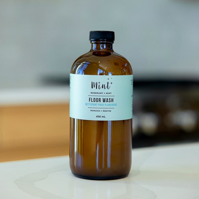 Mint Floor Wash bottle displayed on a kitchen counter, perfect for eco-conscious households seeking a natural floor cleaner.