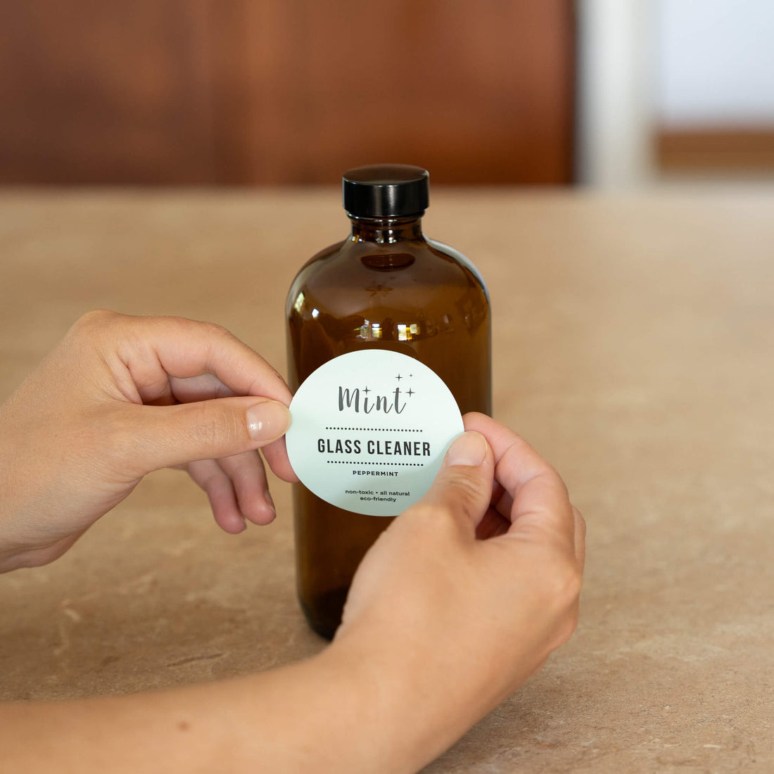 mint glass cleaner label on amber glass bottle