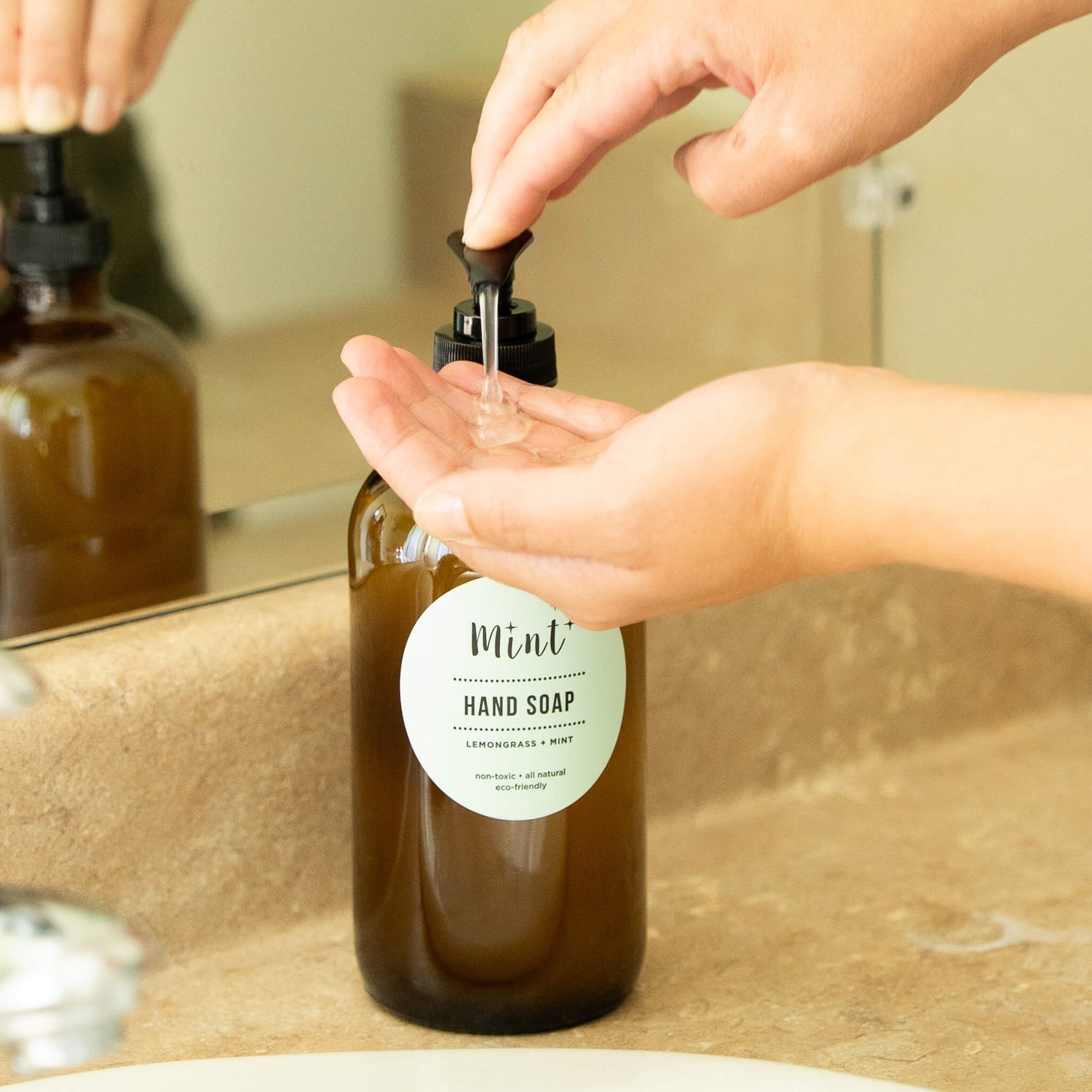 mint hand soap on glass bottle