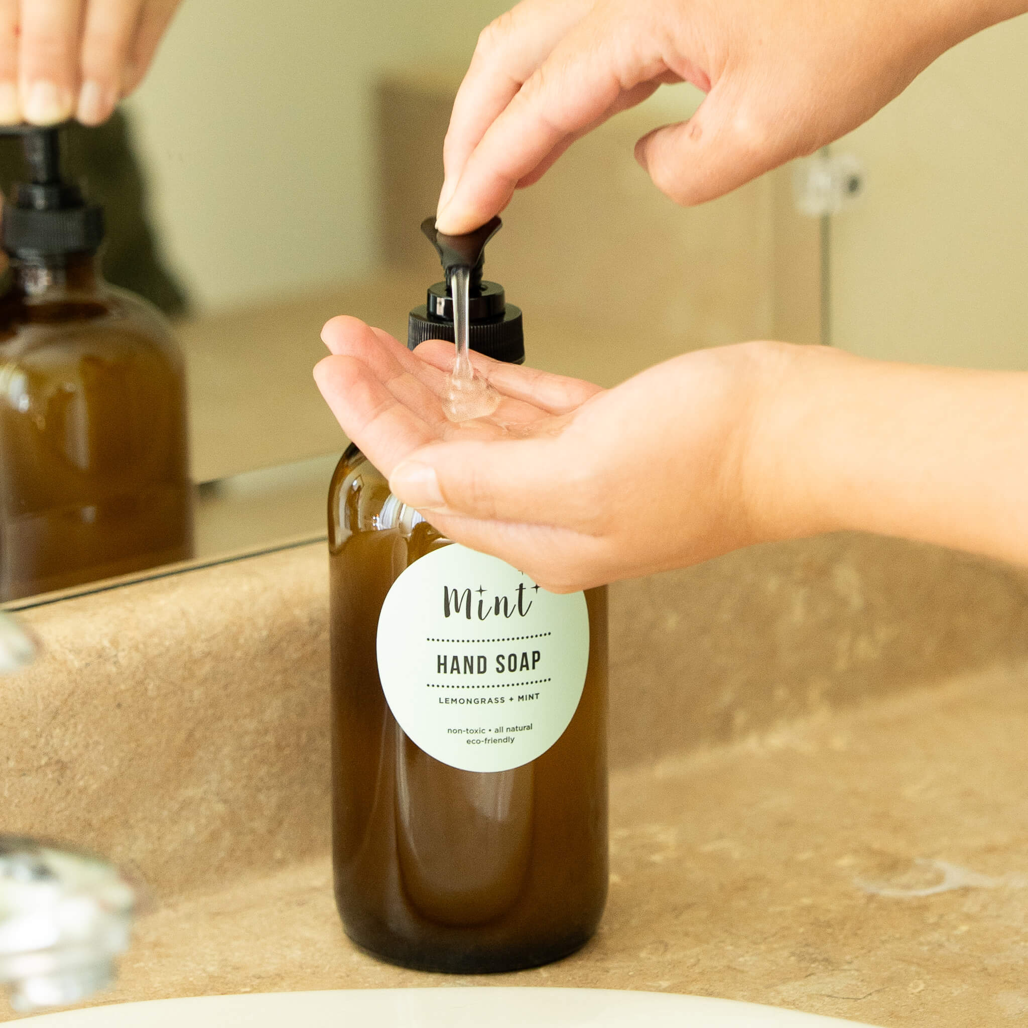 mint hand soap on glass bottle