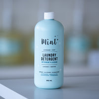 Mint Laundry Detergent bottle with lavender and mint scent, displayed in a stylish setting, ideal for eco-conscious laundry care.