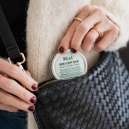 Person holding a container of &