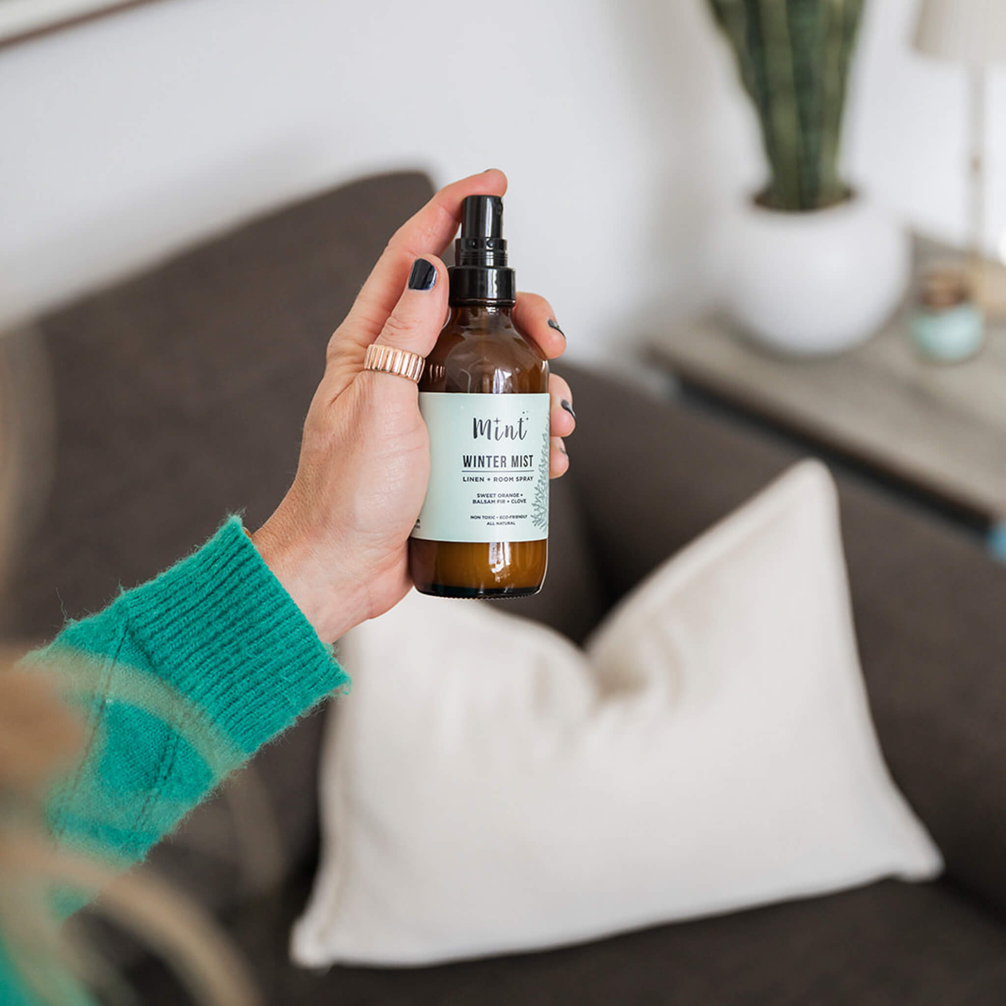 Hand holding a bottle of &