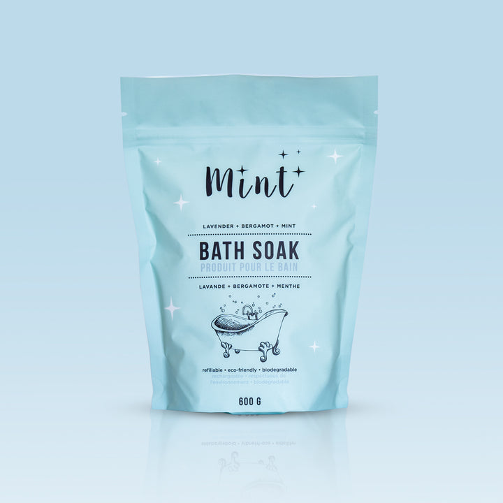 Mint Bath Soak in a 600g pouch with lavender, bergamot, and mint essential oils, shown on a gradient background for a clean, spa-like look.