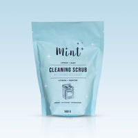 Mint Cleaning Scrub refill pouch on a gradient blue background, labeled with lemon and mint scent, refillable and eco-friendly, 500g size.