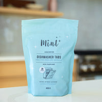 Mint Dishwasher Tabs pouch displayed in a kitchen setting, highlighting its eco-friendly and non-toxic formulation for a clean, fresh kitchen.