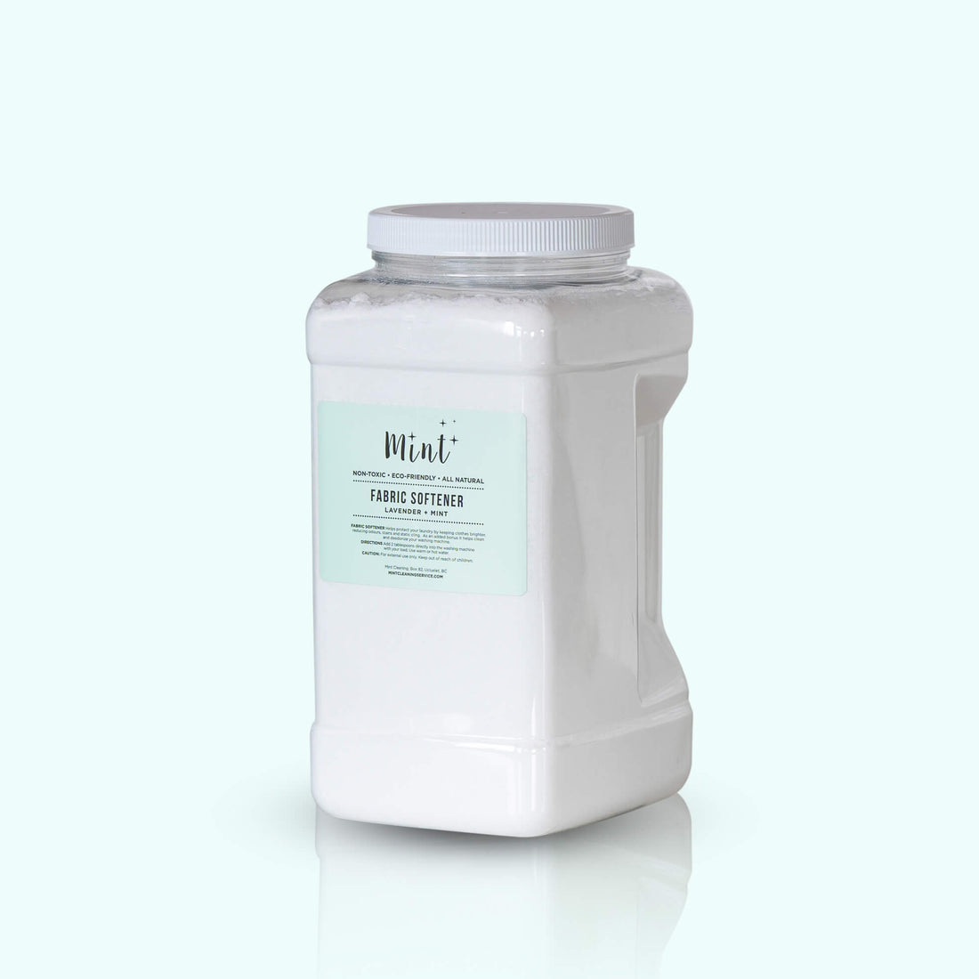 A large white plastic container with a handle, labeled "Mint+ Fabric Softener - Lavender + Mint." The mint green label highlights its non-toxic, eco-friendly properties. The container is set against a soft mint background for a fresh and clean look.