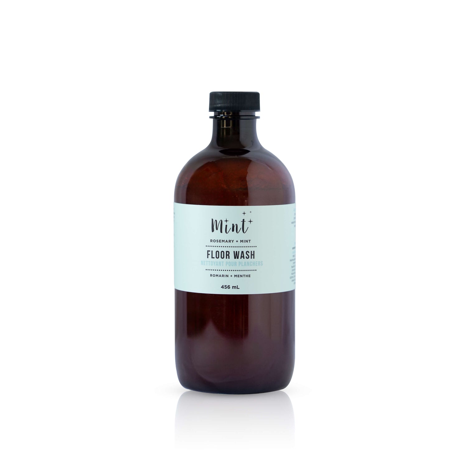 Brown bottle of floor wash with a label on a white background