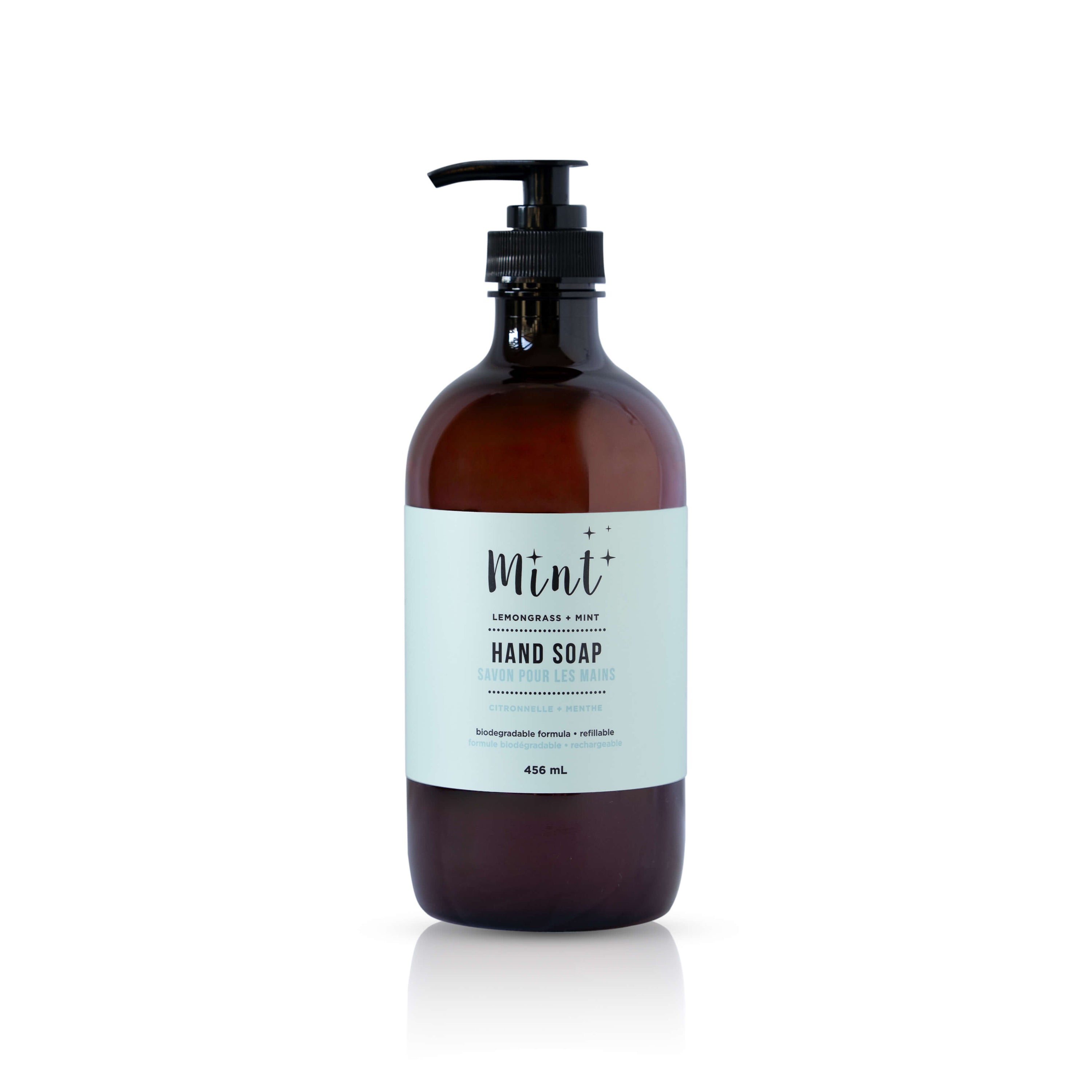 Brown bottle of hand soap with a label on a white background
