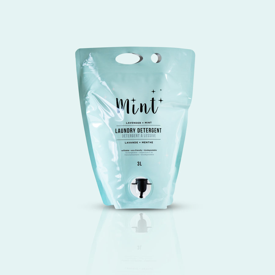 Mint Laundry Detergent refill pouch with lavender and mint scent, featuring a light blue background. The 3L eco-friendly pouch includes a spout for easy dispensing.